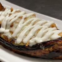Platano Maduro Relleno · Stuffed sweet plantain with shrimp, cheese, and sour cream.