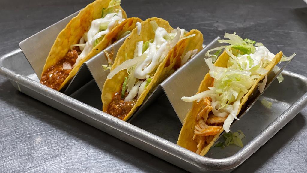 Tacos Trio · Hard shell, chicken or beef,lettuce, cheese and sour cream. * 
 
*Hard shell