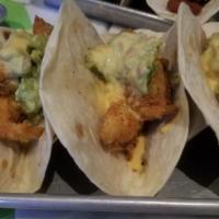 Fish Baja Taco · Fried white fish, greens, guacamole and cheese. * 
 
*Flour tortilla
