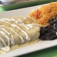 Shrimp Enchiladas · With poblano pepper-ricotta sauce and melted cheese, yellow rice and beans.