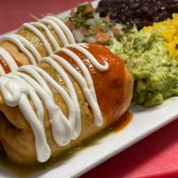 Chimichangas · Fried flour tortilla pockets with chicken or beef, red, green salsa and sour cream, rice and...