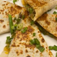 Pulled Chicken Quesadilla  · Seasoned smoked chicken,  trinity  of peppers and onion, shredded Jack & Cheddar cheese in f...