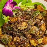 Crispy Brussel Sprouts  · Fresh crispy fried served with smoked bacon, red onion, balsamic drizzle and herb-cheese con...
