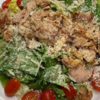 Traditional Caesar  · Crispy Romaine tossed with house made Caesar dressing, garlic croutons, shaved Parmesan chee...