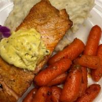 Skillet Seared Atlantic Salmon · Skillet seared center cut salmon filet, topped with herb garlic butter served with country m...