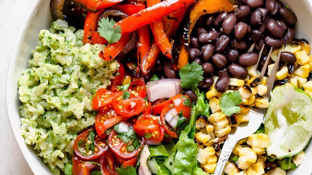 Ultimate Veg Rice Bowl · Roasted veggies, dressing, rice and beans.