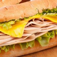 Turkey Sandwich · Roasted Turkey, lettuce, mayonnaise, tomato, onion on a bread roll.