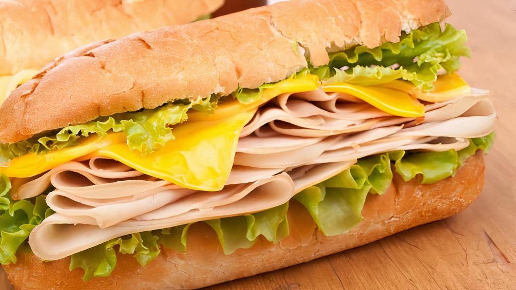 Turkey Sandwich · Roasted Turkey, lettuce, mayonnaise, tomato, onion on a bread roll.