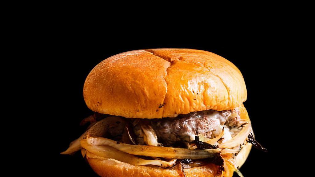 Oklahoma Onion Burger · Charred onions with beef patty smashed right over the top.