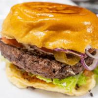 Spicy Habanero Burger · Angus beef patty topped with habañero heat sauce, charred jalapeño and onion blend, fried ja...