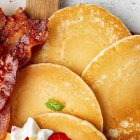 Pancake Platter · Three homemade buttermilk pancakes served with 2 eggs, warm syrup, butter and your choice of...