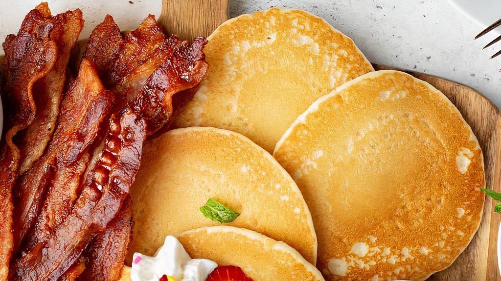 Pancake Platter · Three homemade buttermilk pancakes served with 2 eggs, warm syrup, butter and your choice of ham, crispy bacon or a sausage patty.