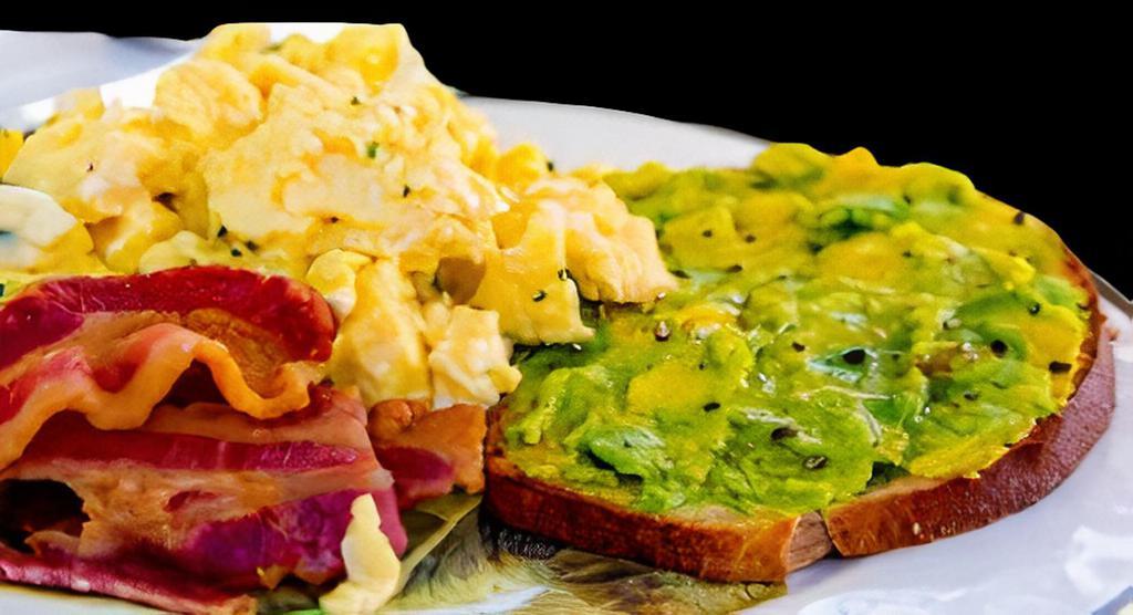 Bacon Egg Avocado Toast · Two eggs scrambled, bacon and avocado toast.