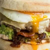 Ultimate Breakfast Beef Burger · English muffins toasted, sriracha mayo, hash browns, smashed avocado, bacon, cheeseburger, C...