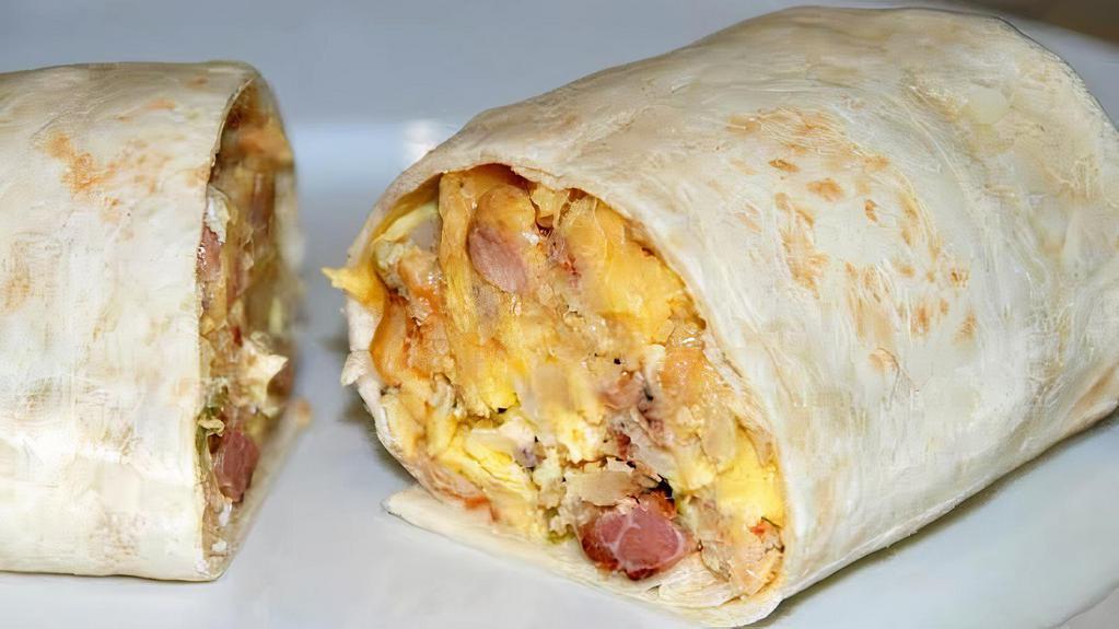Classic Trio 3 Meat Wrap · Ham, bacon, sausage, scrambled eggs & American cheese, served with hash browns.