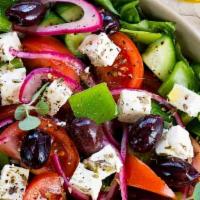 Greek Salad · Lettuce, tomato, feta cheese, kalamata olives, cucumbers and onions.