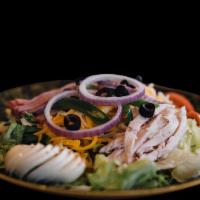 Chef Salad · House made turkey, boiled egg, roast beef, ham and American cheese over lettuce, onions, tom...