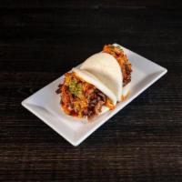 Kimchi Buns · Pulled pork with soy glaze, spicy mayo, and sweet hot glaze, topped with kimchi