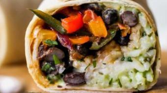 Vegetarian Burrito · Diced zucchini, mushrooms, roasted peppers, carrots, brown rice, black beans with melted jac...