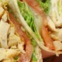 Cajun Chicken Wrap · Sliced Cajun chicken breast, roasted corn, black beans, jack cheese, lettuce, tomatoes, and ...