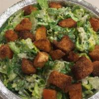 Caesar Salad · Crisp romaine topped with homemade garlic croutons, aged parmesan cheese and homemade dijon ...