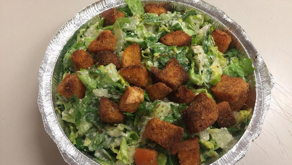 Caesar Salad · Crisp romaine topped with homemade garlic croutons, aged parmesan cheese and homemade dijon Caesar dressing.