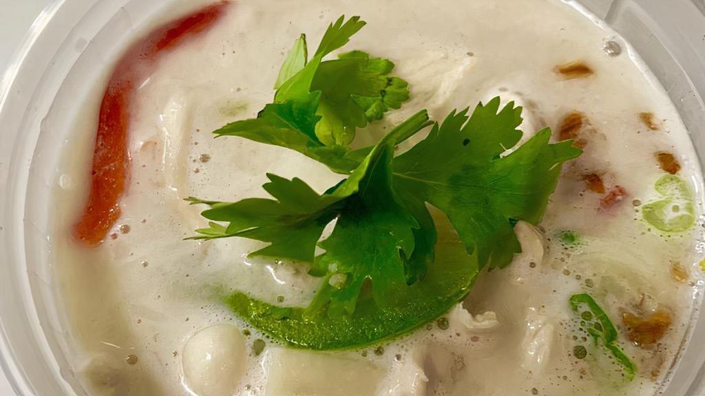 Tom Kha Soup · Coconut lemongrass soup with coconut milk, roasted chilies, kaffir lime leaf, lime juice, mushrooms, green onions, and Thai spices.