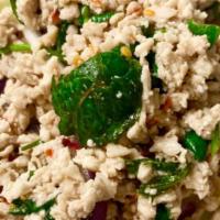 Larb Gai (Chicken Salad) · Steamed minced chicken with scallion, onion, mint leaves, ground roasted rice, chili in spic...
