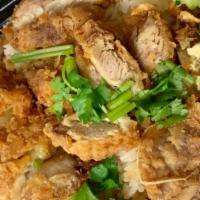 Khao Man Gai Tod · Fried chicken over ginger rice. Served with sweet chili sauce.