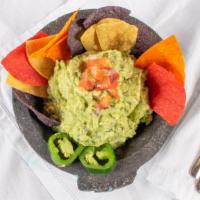 Guacamole Crudo · Serves two to four people. Grande, guacamole, and chips.