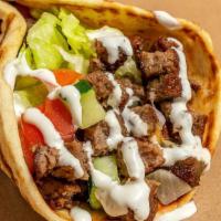 Lamb Gyro · Grilled Lamb served on pita with choice of salad and any of shahs sauces