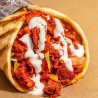 Chicken Gyro · Chicken gyro meat marinated and grilled to perfection, served on a fresh eight-inch pita and...