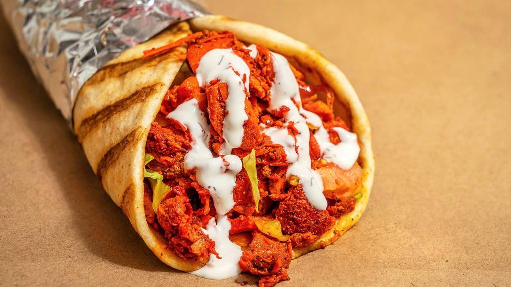 Chicken Gyro · Chicken gyro meat marinated and grilled to perfection, served on a fresh eight-inch pita and toppings of your choice
