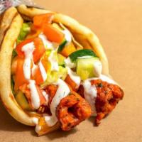 Kofta Kebab On Pita · Two skewers of chopped, freshly ground chicken mixed with fresh herbs and spices, cooked on ...