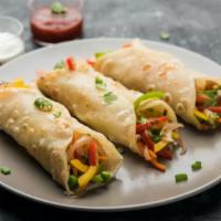 Crispy Vegetable Rolls · A blend of fresh seasonal vegetables with a hint of seasoning, wrapped in a deliciously flak...