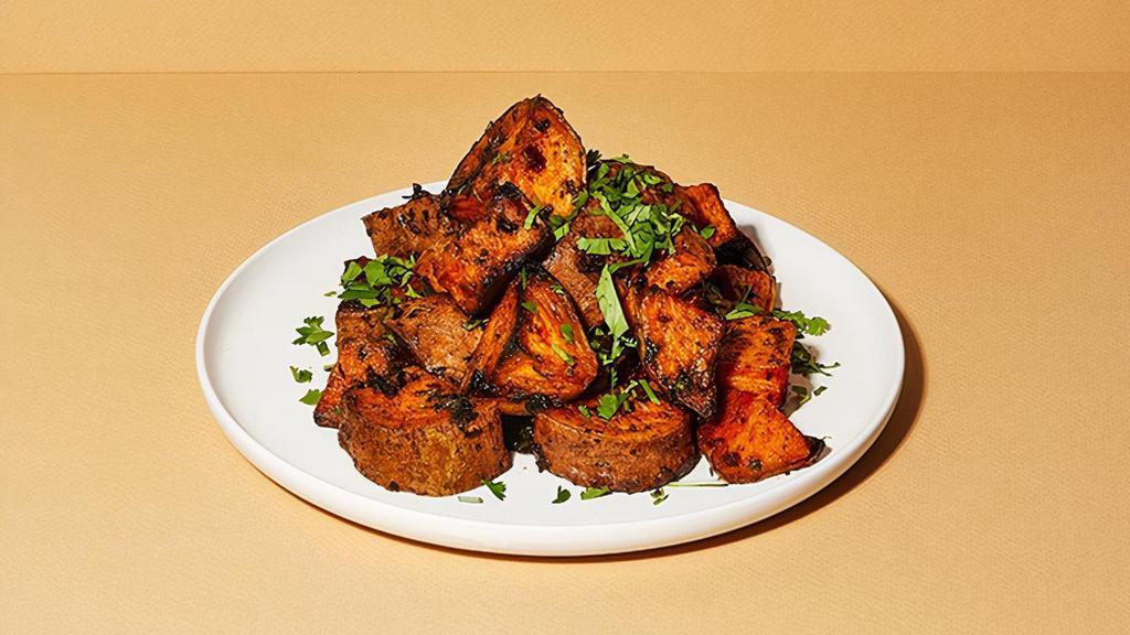 Side Roasted Sweet Potatoes · South Indian-inspired sweet potatoes with mustard seed, curry leaf, and cilantro, with a side of coconut ranch