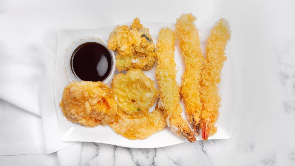 Shrimp Tempura · Two pieces of shrimp and five pieces of assorted vegetables battered and fried.
