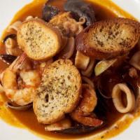 Zuppa Di Pesce Con Crostone All'Aglio · seafood soup with garlic crostone bread
