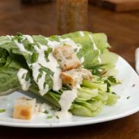 Caesar · Romaine, Croutons,  Shaved Parmiggiano, Traditional Dressing