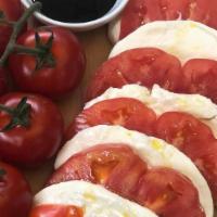 Caprese · Fresh Mozzarella, Ripe tomato, Roasted Red Peppers, Balsamic