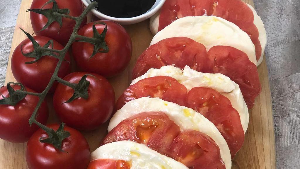 Caprese · Fresh Mozzarella, Ripe tomato, Roasted Red Peppers, Balsamic