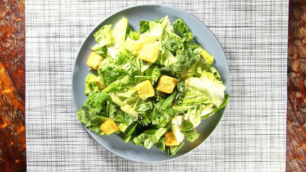 Caesar Salad · Romaine lettuce tossed with caesar dressing and croutons. Add grilled chicken for an additional charge.