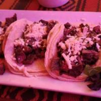 3 Grilled Skirt Steak Tacos · Covered with tomatillo-avocado salsa and queso cotija. 3 tacos in hard or soft shell served ...