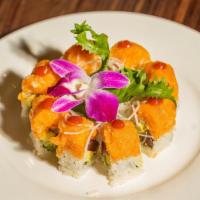 Spicy Girl Roll · Black pepper tuna avocado honey wasabi sauce topped with spicy salmon crunch chili sauce and...