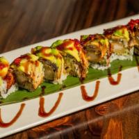 Dinosaur Roll · Shrimp tempura and cucumber topped with eel avocado in eel sauce and tobiko.