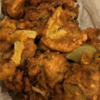 Vegetable Pakora (Per Lb) · Fritters with freshly chopped onions, potatoes, and assorted vegetables.