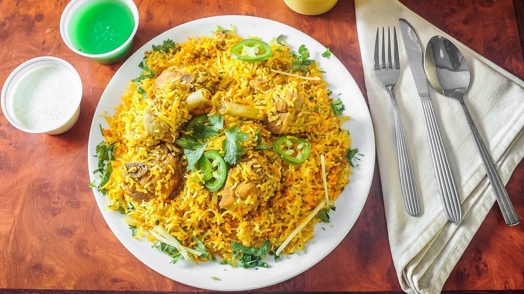Chicken Biryani · Basmati rice cooked with delicious chicken, herbs and spices.