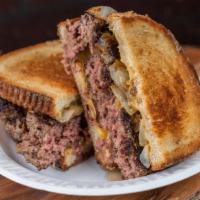 Patty Melt · Buttered rye bread, melted cheese, fried onion, and six ounce burger.