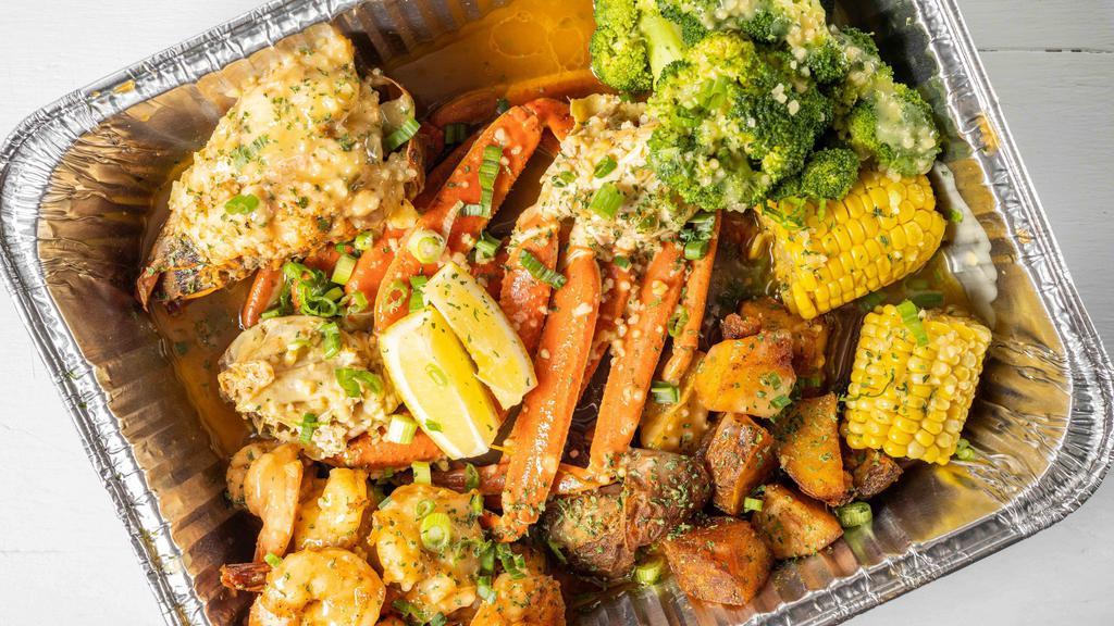 The Ultimate Boil Crab Bag · Includes two full crab leg clusters 10 pieces shrimp, one lobster tail, beef sausage with corn and broccoli and potatoes dropped in our Sea Island pot of herbs.