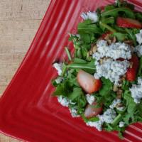 Arugula Salad · Baby arugula, blue cheese, strawberries, walnuts with Italian lemon vinaigrette. Add grilled...